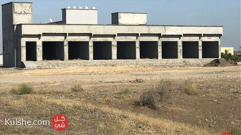 ارض صناعية مبني عليها 10 محلات عضم - Image 1