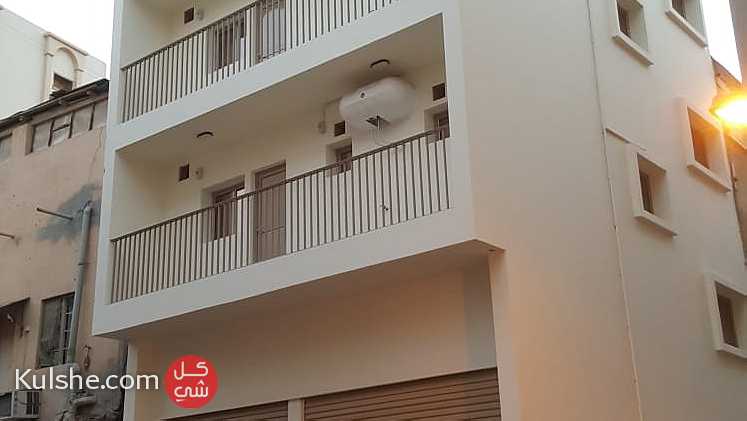 بنايه جديده للبيع في راس رمان في منطقه الزووده علي شارعين زاويه - صورة 1