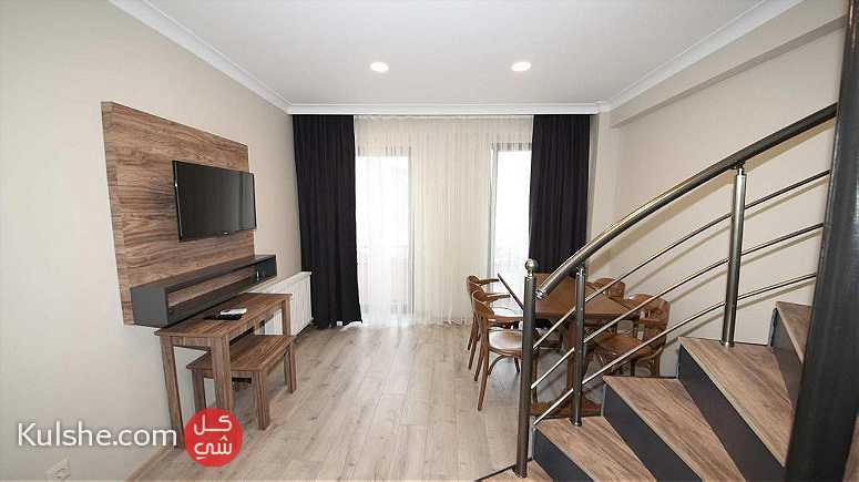 شقة فندقية من غرفتين نوم وصالة للايجار اليومي في شارع الاستقال - Image 1