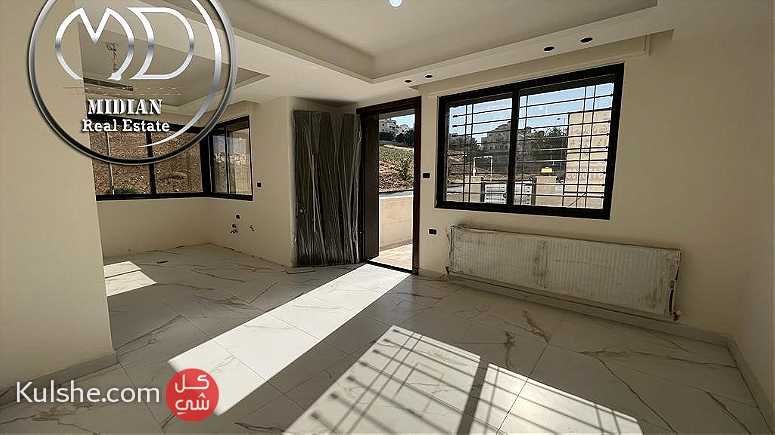 شقة ارضية جديدة للبيع عبدون مساحة 200م مع ترس و حديقة 100م بسعر مميز - Image 1