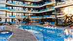 غرفة وصالة مع مسبح بأعلى مواصفات وبالتقسيط المريح في دبي - Image 1